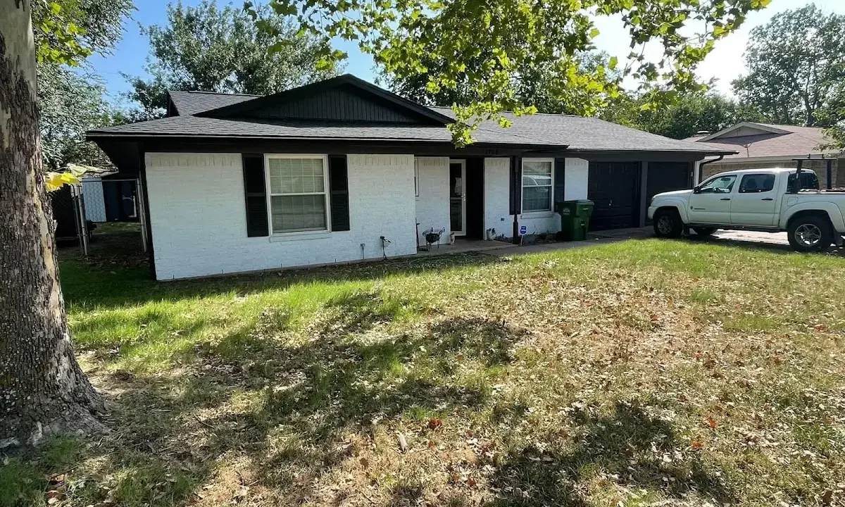 Professional roofing crew working on a residential roof in Franklin Park